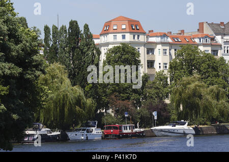 Berlin, Germany, old buildings and sport boats on the bank of the Bundesrat in Berlin-Moabit Stock Photo