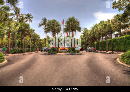 Entrance of the Naples Pier with tropical flowers in the summer in Naples, Florida Stock Photo