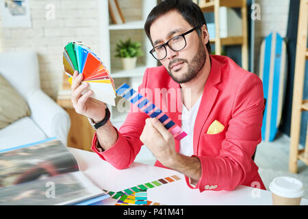 Pensive stylish choosing new line colors Stock Photo