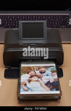 Compact printer for house use. Printer print family image Stock Photo
