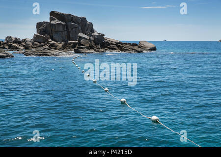 Floating white buoy on the sea background, safety area for separate between    swimmer and boat, Stock Photo