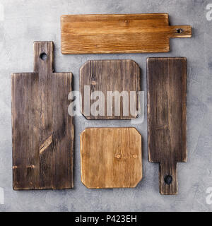 Set of cutting boards on gray concrete background. Top view. Stock Photo