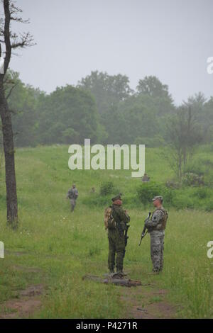 Members of the PA National Guard's 2-112th Infantry Battalion, 56th Stryker Brigade, 28th Infantry Division, train with Lithuanian soldiers in June 2006 as part of the National Guard's State Partnership Program. Pennsylvania National Guard members concurrently trained in Lithuania and Estonia as part of multinational exercises there. Stock Photo