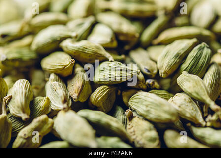 Background of green cardamom pods. Selective focus. Stock Photo