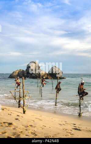 Stilt fishermen, Ahangama, Sri Lanka Stock Photo