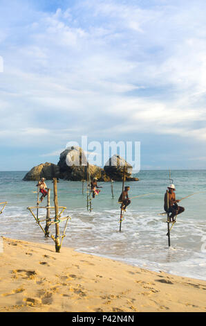 Stilt fishermen, Ahangama, Sri Lanka Stock Photo