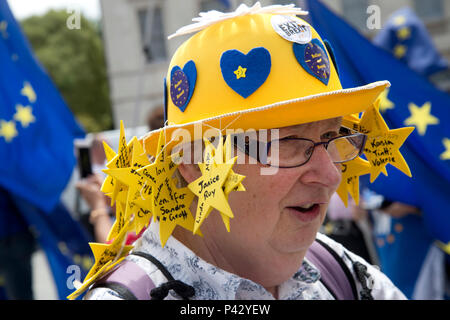London, UK. 20 June 2018. Protesters outside  Parliament, Westminster, London as Members of Parliament debate the European Union withdrawal bill, June 20th 2018. A woman from Poole, Dorset wears a hat with the names of British ex patriates living in Spain who were not able to return to Britain to vote in the EU referendum. Credit: Jenny Matthews/Alamy Live News Stock Photo