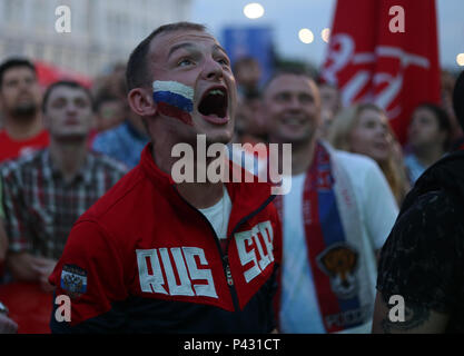 Nizhny Novgorod, Russia. 19th June, 2018. A man with a flag painted on his face celebrating the Russian win. Russians fans celebrate the victory of their team who beat Egypt (3-1) during the Russia's 2nd Group A match at the FIFA world cup 2018 Credit: SOPA Images Limited/Alamy Live News Stock Photo