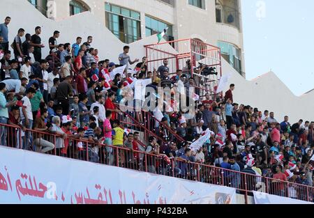 Gaza City, Gaza Strip, Palestinian Territory. 20th June, 2018. Palestinian fans attend the first leg football match of the Palestine Cup final between Hilal al-Quds football club and Shabab Khan Younis football club at the Palestine Stadium in Gaza City on June 20, 2018 Credit: Mahmoud Ajour/APA Images/ZUMA Wire/Alamy Live News Stock Photo