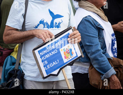 Las Palmas, Gran Canaria, Canary Islands, Spain 20th June, 2018. 'A man holds a placard saying Ningun ser humano es illegal' (No human being is illegal) at World Refugee Day march in support of open borders in Las Palmas, the capital of Gran Canaria. Credit: ALAN DAWSON/Alamy Live News Stock Photo