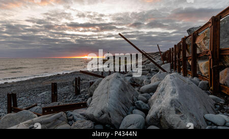 Aberystwyth, Ceredigion, Wales, UK 20th June 2018 UK Weather: A view of the weathered sea defence along Tanyblwch beach in Aberystwyth, as the sun sets over the west coast on the eve of summer solstice. © Ian Jones/Alamy Live News. Stock Photo