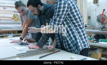Young team of architects working on a new project using digital tablet Stock Photo