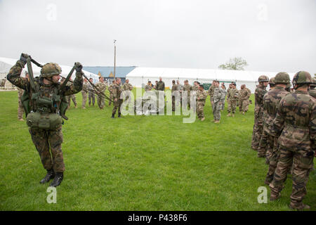 German jumpmasters deploy a parachute during sustained airborne training before airborne operations from a mock C-160 Transall during the 72nd Anniversary of D-Day, Sainte-Mere-Eglise, France, June 4, 2016. The Jump is conducted to commemorate the sacrifice of Soldiers during World War II, and to foster and nurture U.S. and German relationships, develop interoperability during training, and to provide a basis for future operations in training and real world environments. (U.S. Army photo by Spc. Tracy McKithern/Released) Stock Photo