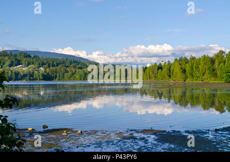 Burrard Inlet in Port Moody, BC, Canada, as viewed from Rocky Point Park.   Urban nature in Metro Vancouver suburb. Stock Photo