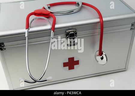 Anodised Aluminium First Aid Box with Stethoscope. Stock Photo