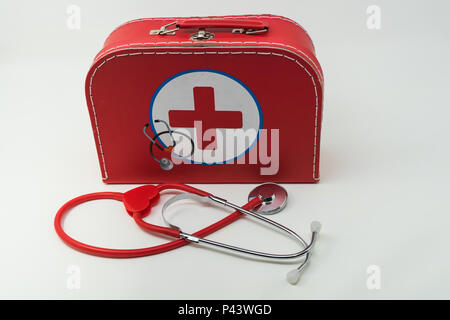 Red First Aid Box with Stethoscope. Stock Photo