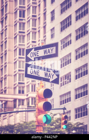 Vintage toned picture of traffic lights and One Way signs on Manhattan, New York City, USA. Stock Photo