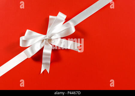 Pink ribbon bow on white background Stock Photo