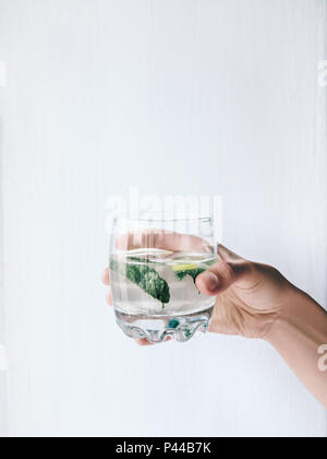 Homemade lemonade Front view Girl is holding a glass of lemonade Photo for posters, banners with copy space Stock Photo