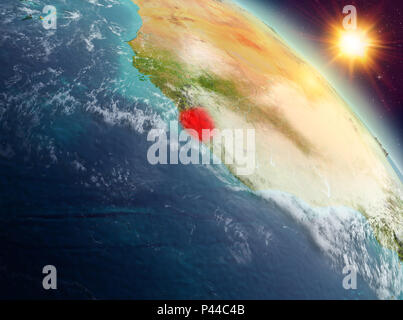 Sunrise above Sierra Leone highlighted in red on model of planet Earth ...