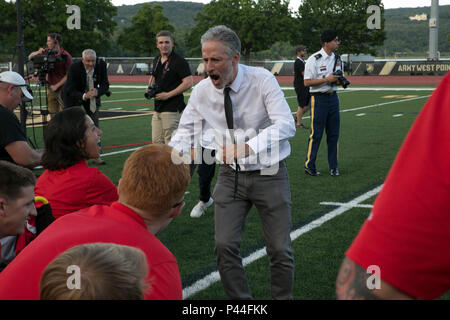 Jon Stewart, the 2016 Department of Defense (DoD) Warriors Game opening ceremony emcee, motivates Team Marine Corps after the opening ceremony at the U.S. Military Academy at West Point, N.Y., June 15, 2016. The 2016 DoD Warrior Games is an adaptive sports competition for wounded, ill and injured Service members and veterans from the U.S. Army, Marine Corps, Navy, Air Force, Special Operations Command and the British Armed Forces. (U.S. Marine Corps photo by Cpl. Calvin Shamoon/Released) Stock Photo