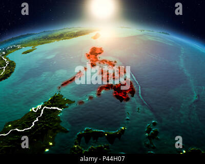 Sunrise above Philippines highlighted in red on model of planet Earth ...
