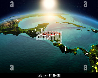 Sunrise above Honduras highlighted in red on model of planet Earth in ...