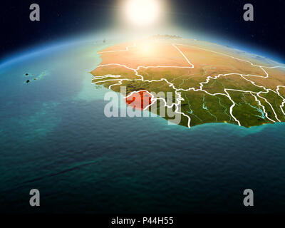 Sunrise above Sierra Leone highlighted in red on model of planet Earth ...