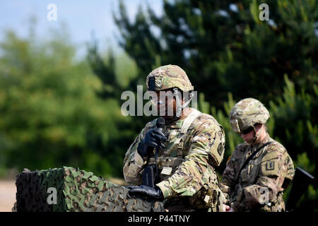 421st Medical Battalion (Multifuntional) conducts a Relinquishment of Command Ceremony in Torun, Poland during Anakonda 16, a Polish Military led exercise, on June 2. 421st MMB is providing NATO ROLE 1 and 2 support (557th Area Support Medical Company), food and water risk assessments along with base camp assessments (64th Medical Detachment VSS and 71st Medical Detachment Preventive Medicine), and behavioral health services (254th Combat Operational Stress Control) in various locations in Poland during the exercise. (U.S. Army photo by Capt. Jeku Arce, 30th Medical Brigade Public Affairs) Stock Photo