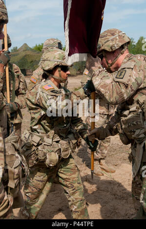 421st Medical Battalion (Multifuntional) conducts a Relinquishment of Command Ceremony in Torun, Poland during Anakonda 16, a Polish Military led exercise, on June 2. 421st MMB is providing NATO ROLE 1 and 2 support (557th Area Support Medical Company), food and water risk assessments along with base camp assessments (64th Medical Detachment VSS and 71st Medical Detachment Preventive Medicine), and behavioral health services (254th Combat Operational Stress Control) in various locations in Poland during the exercise. (U.S. Army photo by Capt. Jeku Arce, 30th Medical Brigade Public Affairs) Stock Photo