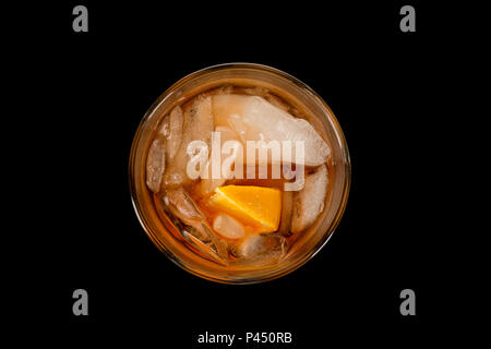 Top view glass of negroni cocktail decorated with citrus on dark background. Stock Photo