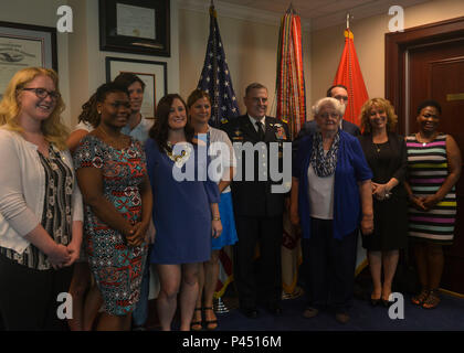 Family members of the seven U.S. service members killed April 7, 2001 in a helicopter crash fulfilling the mission of the Defense POW/MIA Accounting Agency met with U.S. Army Chief of Staff Gen. Mark Milley to reminisce the memory of their lost loved ones, June 23, 2016. Milley provided a tour of the Pentagon that ended in a ceremony unveiling a plaque in the POW/MIA memorial hall honoring the lives lost 15 years ago. “We never leave a fallen comrade,” said Milley. “Even if the risk, or even if it’s the cost of our own life, we will bring our fellow fallen Marines, Airmen, Soldiers and Sailors Stock Photo