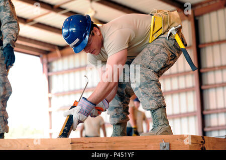 Cadets at the U.S. Air Force Academy participated in Field Engineering & Readiness Laboratory at Jacks Valley, constructing two Hogan houses to support Navajo families. The program involved civil and environmental engineering students, Air Force Reserve Command craftsmen, and Southwest Indian Foundation collaboration. Over five weeks, cadets performed surveying, construction techniques, and materials handling under mentor supervision, gaining practical experience in engineering, project management, teamwork, and community development. Stock Photo