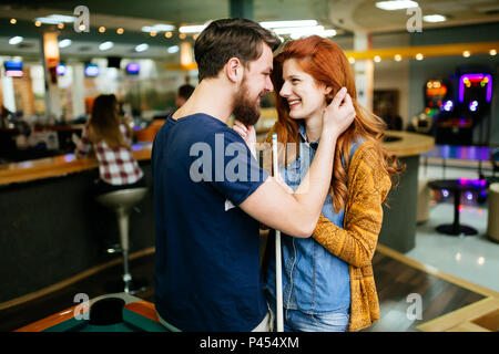 Couple hugging in snooker bar Stock Photo
