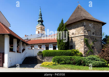 06 May 2018, Novy Jicin, Czech Republic. Old turret and Church of the Assumption of the Virgin Mary Stock Photo