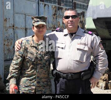 Lance Cpl. Christina Flores (left), vehicle motor operator with the Combat Logistics Battalion 2, Logistics Combat Element, participates in an open doors display event with U.S. soldiers and Bulgarian Military soldiers at the Bulgarian Military Police Regional Department in Sliven, Bulgaria, June 1, 2016. This event allowed the local community to see the partnership between U.S. and Bulgarian forces.  (U.S. Army photo by Spc. Staci Evbuomwan, 194th Engineer Brigade, Tennessee Army National Guard) Stock Photo