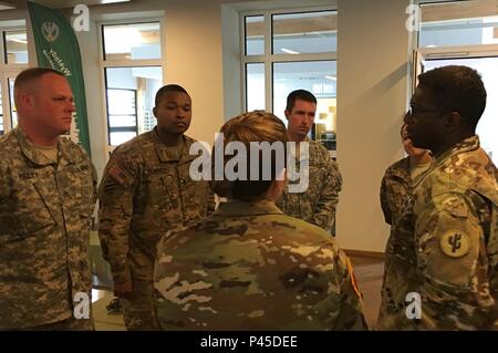 U.S. Army Reserve Brig. Gen. Jonathan McColumn (right), Commanding General  of the 103rd Expeditionary Sustainment Command, Des Moines, Iowa, discusses  logistical operations and the success of training exercise Anakonda 16 with 103rd  ESC