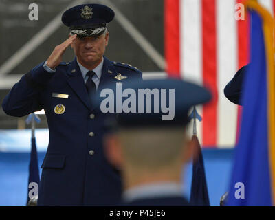 Lt. Gen. Samuel D. Cox, 18th Air Force commander, salutes during the playing of the National Anthem at the 89th Airlift Wing change-of-command ceremony at Joint Base Andrews, Md., June 17, 2016. Col. John C. Millard relinquished command to Col. Casey D. Eaton, who will oversee the 89th AW, a combat-ready wing of more than 1,100 Airmen and provides Special Airlift Mission airlift and support to the president, vice president, cabinet members, combatant commanders and other senior military and elected leaders, supporting White House, Air Force chief of staff and Air Mobility Command missions. (U. Stock Photo