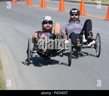 Army Veteran Staff Sgts. Matthew Mihacsi, left, and Victor Sassoon (riding for TEAM SOCOM), go head-to-head in a battle of the beards at the Recumbent Cycling event at the 2016 DoD Warrior Games on June 18. The Games, running from June 15-21,  are a Paralympic-type event for wounded, ill and injured personnel from the military representing all four U.S. Services, Special Operations Command and the United Kingdom. This year's event is being held at the U.S. Military Academy at West Point, N.Y. Stock Photo