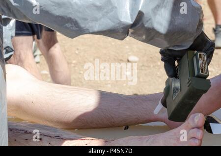A U.S. Army Reserve soldier with the 369th Chemical Company collects a ...