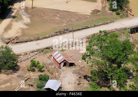 West Virginia Army National Guard Soldiers fly over the Greenbrier County, W.Va. areas in a UH-60 Blackhawk on June 26th, 2016. The flight allows the National Guard to identify the areas in the county that were heavily impacted by the deadly flood that occurred on June 23, 2016. This aerial view shows a road collecting debris from the damage of the flood.  (U.S. Army National Guard photo by Sgt. Penni Harris) Stock Photo