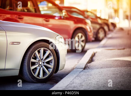 Cars moving on the road in city in early morning Stock Photo