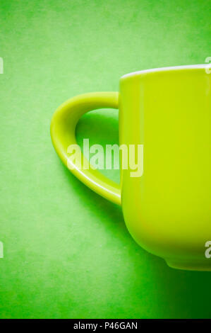 green cup for coffee on a green background Stock Photo