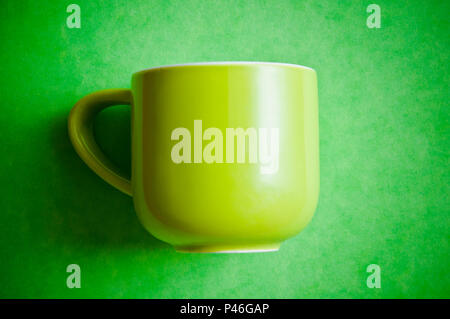 green cup for coffee on a green background Stock Photo