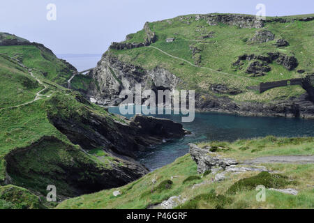 Tintagel castle ruin and water inlet seen from across the headland in Cornwall England U.K. Stock Photo