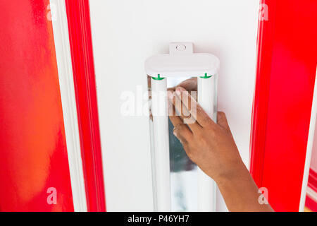 Setup fluorescent light green power on ceiling, selection focus, copy space background. Stock Photo