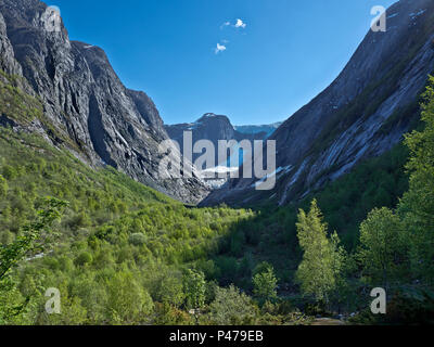 Norway, picture of glacier between maintains, near Olden, Spring, snow on the tops of the mountings,blue sky, near Olden fjord Stock Photo