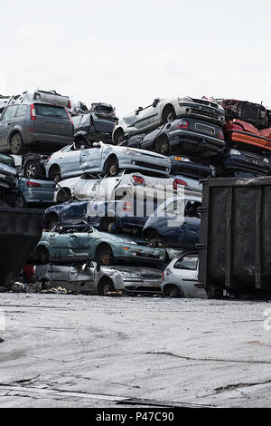 Scrapyard with car bodies piled up Stock Photo