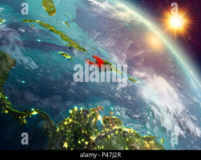 Sunrise above Haiti highlighted in red on model of planet Earth in ...