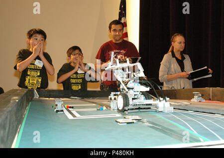 Students from Forest Edge Elementary in Reston, Virginia, test their robot for Naval Surface Warfare Center, Carderock Division during the 2016 Carderock LEGO Robotics Competition in West Bethesda, Maryland, on June 10, 2016. The competition challenges students to design, build, and program robots to perform tasks, promoting STEM education, problem-solving, teamwork, and engineering skills in partnership with U.S. Navy personnel and engineers. Stock Photo